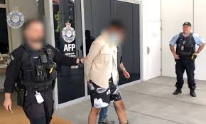 A blurry picture of police officers arresting a man