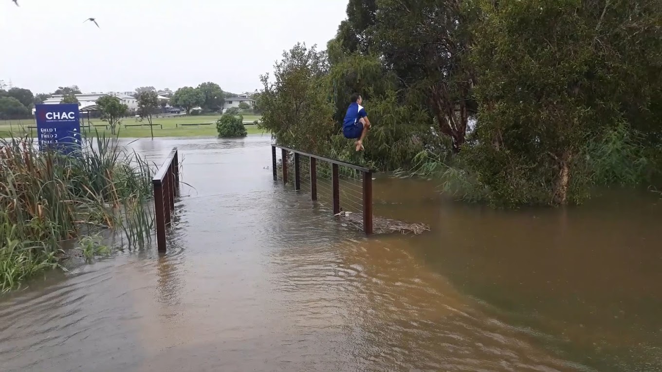 A photo of someone jumping into a lake